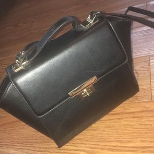 Black leather bag with gold accents